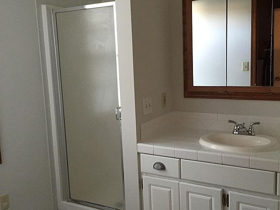 Master bedroom bathroom. There is a Laundry room next to bathroom.
