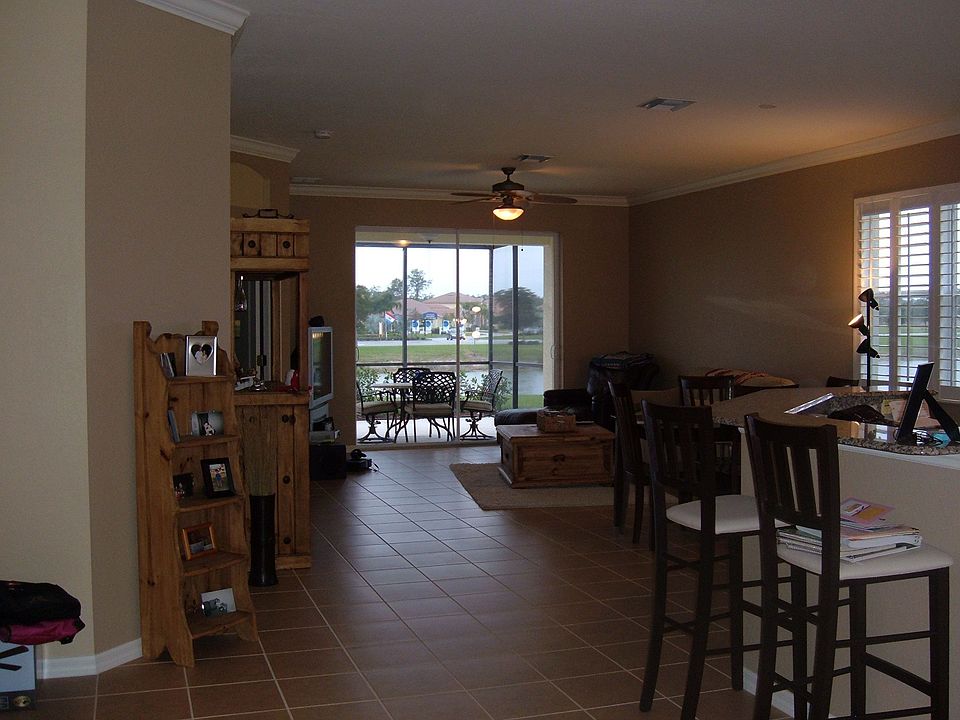Tile throughout (carpet in bedrooms) / crown molding / plantation shutters