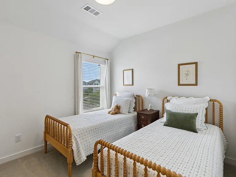Second upstairs bedroom with two twin beds.