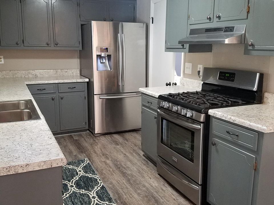 kitchen, door to separate laundry room can be seen on the ri