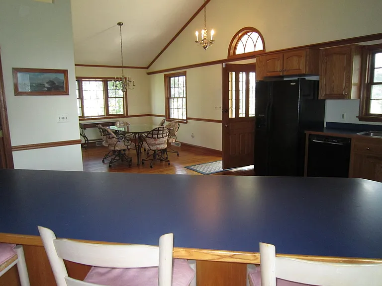 Dining Area and Kitchen from behind Kitchen Peninsula
