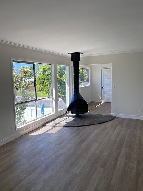 Living Room with office area and stove fireplace