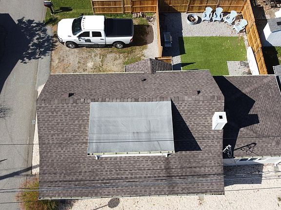 Aerial shot of the house, parking, and backyard. High St runs vertically on the left and Cherry St is at the bottom.