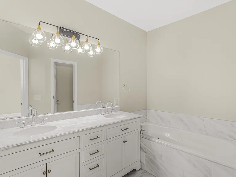 Upgraded bathroom with top of the line Italian Tiles. Jetted soaking tub