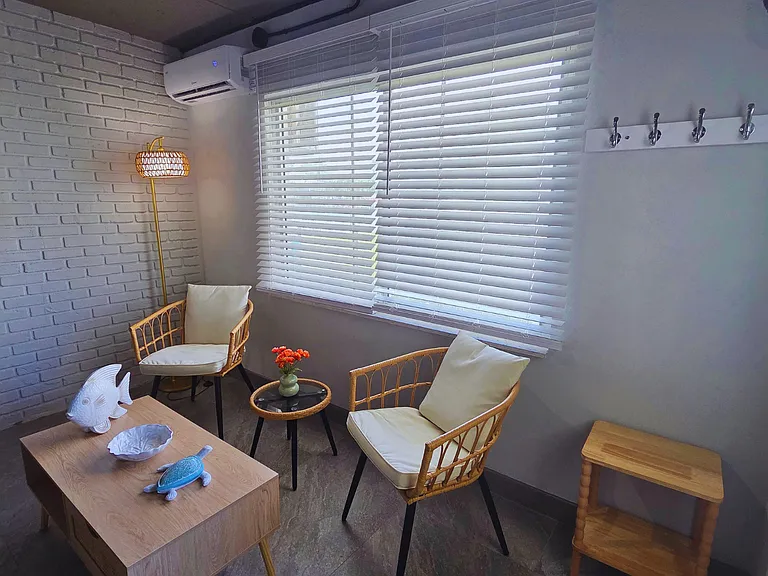 Spacious window with stylish blinds and ambient lighting