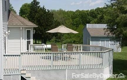 Back of house, deck. : Perfect place for outdoor dining & entertaining. Shed/playhouse in background