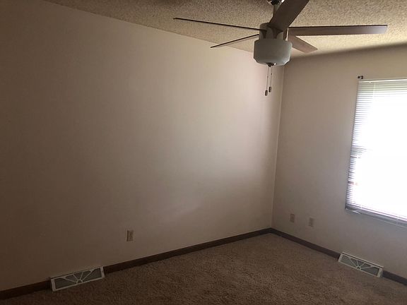 BEDROOM #2 TO THE BACK OF THE HOUSE WITH NEW LIGHT CEILING F