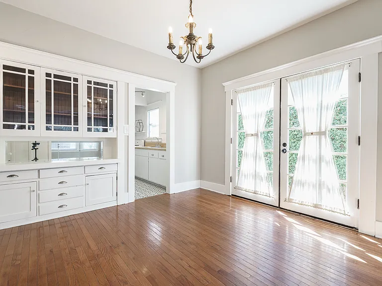 Dining room with French doors leading to side yard and deck area