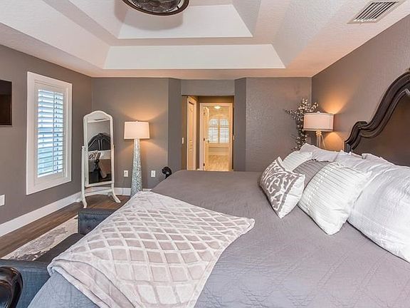 Plantation shutters, new flooring, new baseboard and trim.  Love the grey hues.. perfect blend of coastal hues is sure to delight.  Master closet features custom built in cabinetry and a second closet.