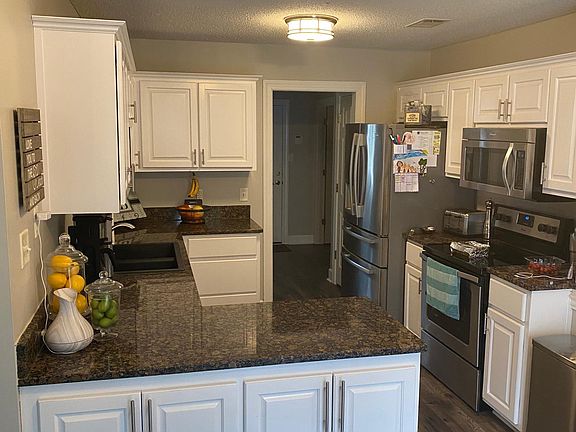 Kitchen cabinets were recently painted.