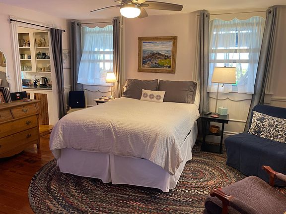 Bedroom with two comfy chairs