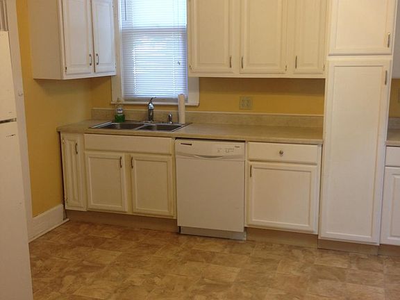 kitchenwith electric stove, frig, dishwasher provided for your convenience. ceiling fan