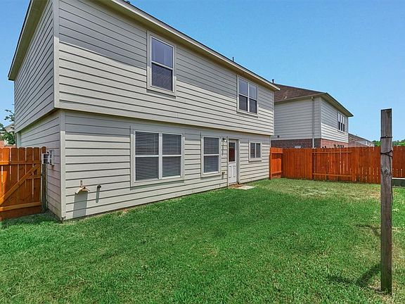This fully fenced backyard is ready for a pool to be built.