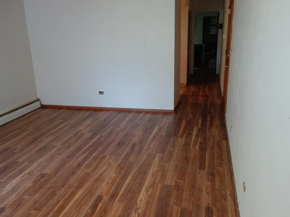 Living room with brand new wood floors.