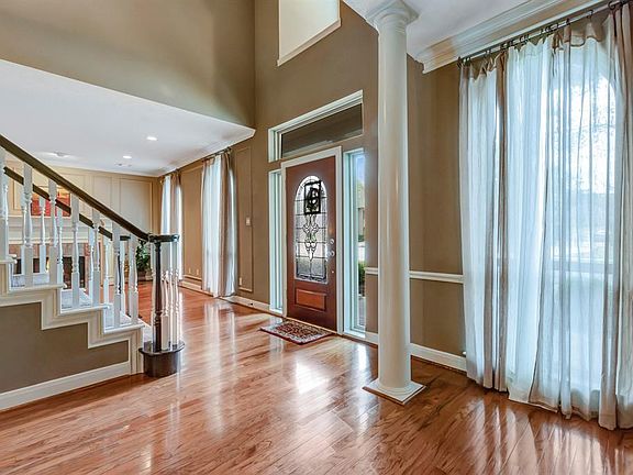 Entry is open and inviting. Sidelights and dormer at leaded glass front door.