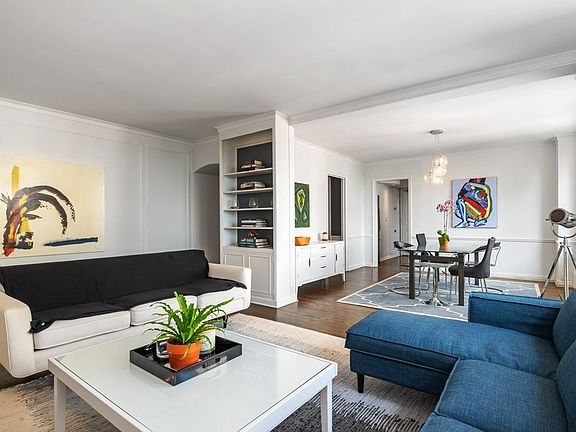 Living room and adjacent dining room leading into the kitchen.