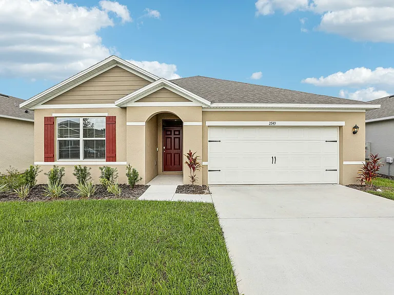 Modern 3/2 single-story home with private driveway and charming curb appeal.