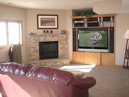 Walkout Lower Level family room w/fireplace & entertianment center!