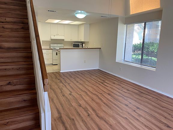 Living room with new vinyl plank flooring throughout and freshly painted interior. Great corner unit with no one living above or below or to the side of you!