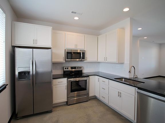 stainless steel appliances, granite countertops, painted cabinets