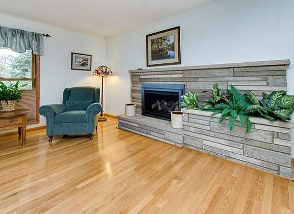 Gorgeous stone fireplace with a beautiful gas insert.