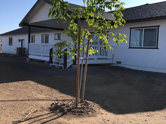 Peaceful and spacious backyard porch for your enjoyment and barbeques.