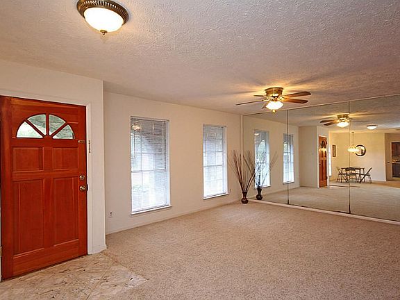 AS YOU ENTER THIS BEAUTIFULLY REMODELED HOME, THE FORMAL LIVING SITS TO THE LEFT
