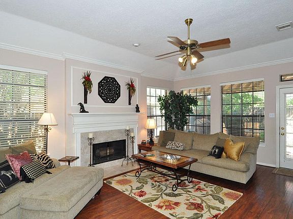 Large family room with hardwood flooring.