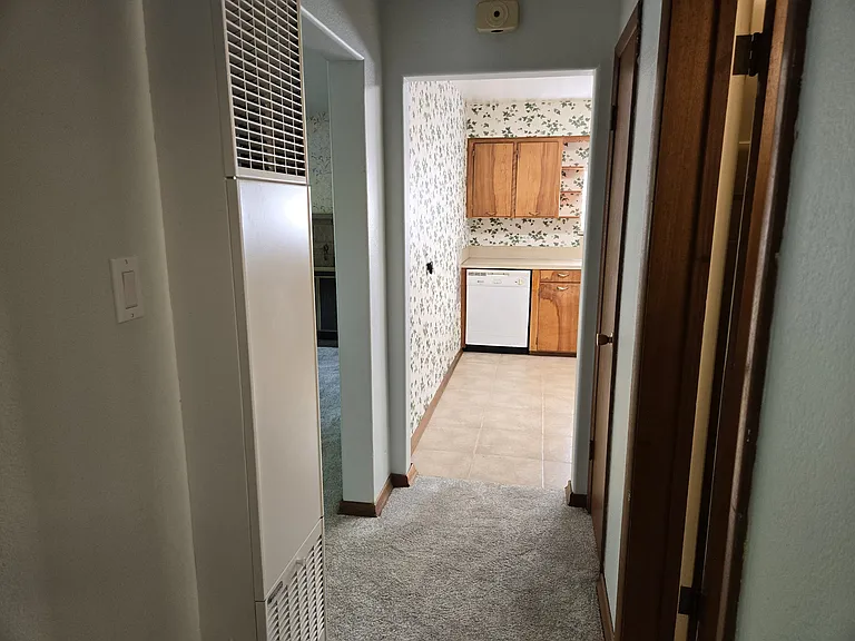 Hallway looking toward the Kitchen.
Furnace is on the wall to the left.