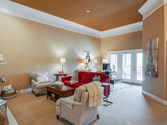 Large open main living space with 12 foot ceilings and beautiful crown molding.
