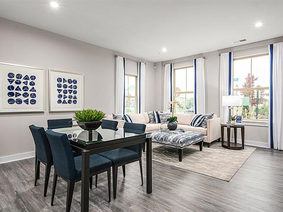 Designed for modern living, the open-concept gathering room and kitchen create the perfect space for entertaining and everyday comfort, with seamless flow, stylish finishes, and plenty of natural light.
