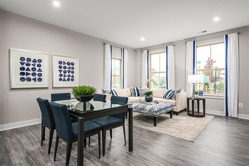 Designed for modern living, the open-concept gathering room and kitchen create the perfect space for entertaining and everyday comfort, with seamless flow, stylish finishes, and plenty of natural light.