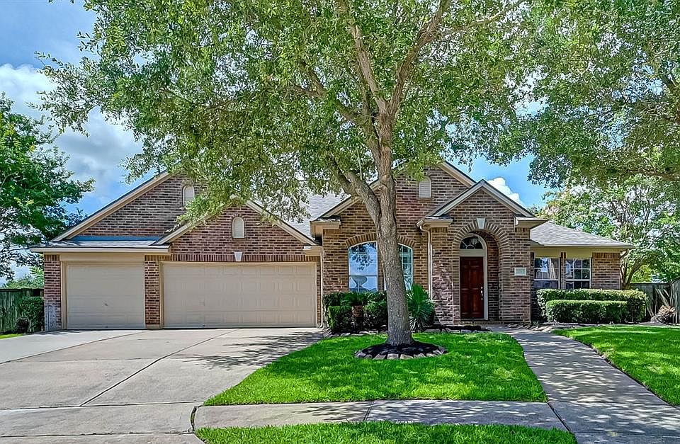 Beautiful David Weekly home offers one of the largest yards at Long Meadow Farms.