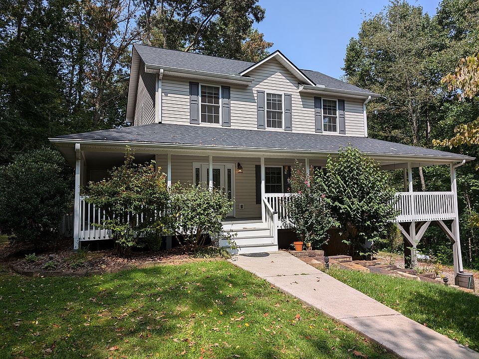 View of the house as you approach. Freshly painted porch, vinyl siding.