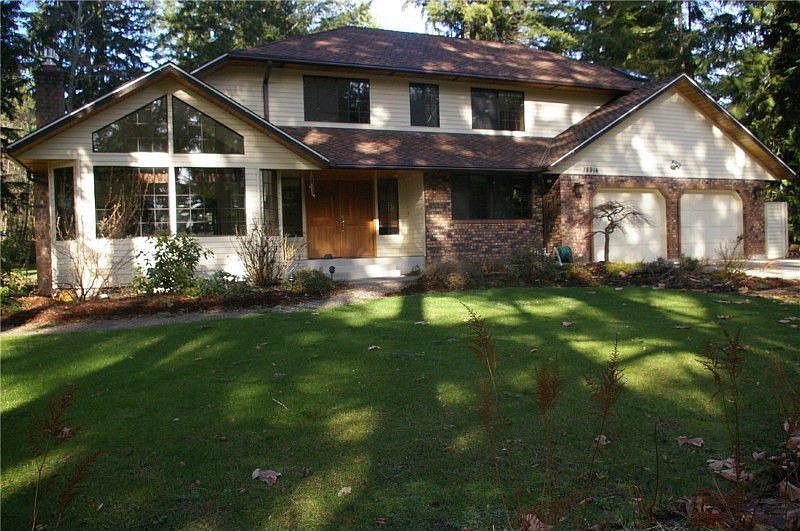 Serena Estates Chaffey Custom home on just over an acre. Cedar Siding, 50 year Presidential Roof, Masonry Fireplace, & Brick accents.