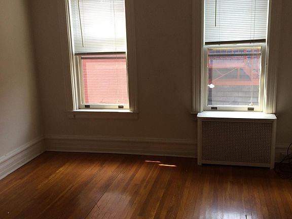 Smaller bedroom with closet and air conditioner provided