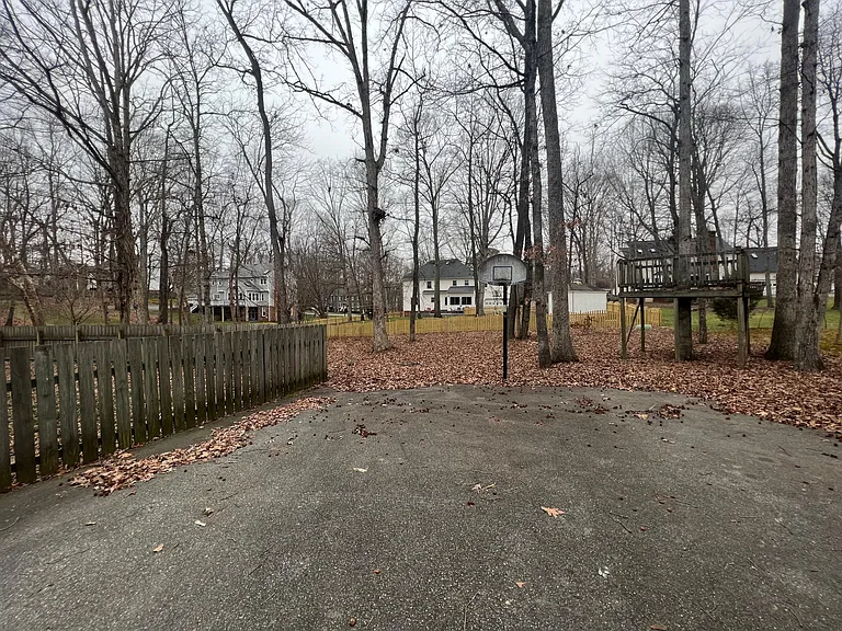 Driveway behind the 2 car garage with plenty of space for parking additional vehicles.