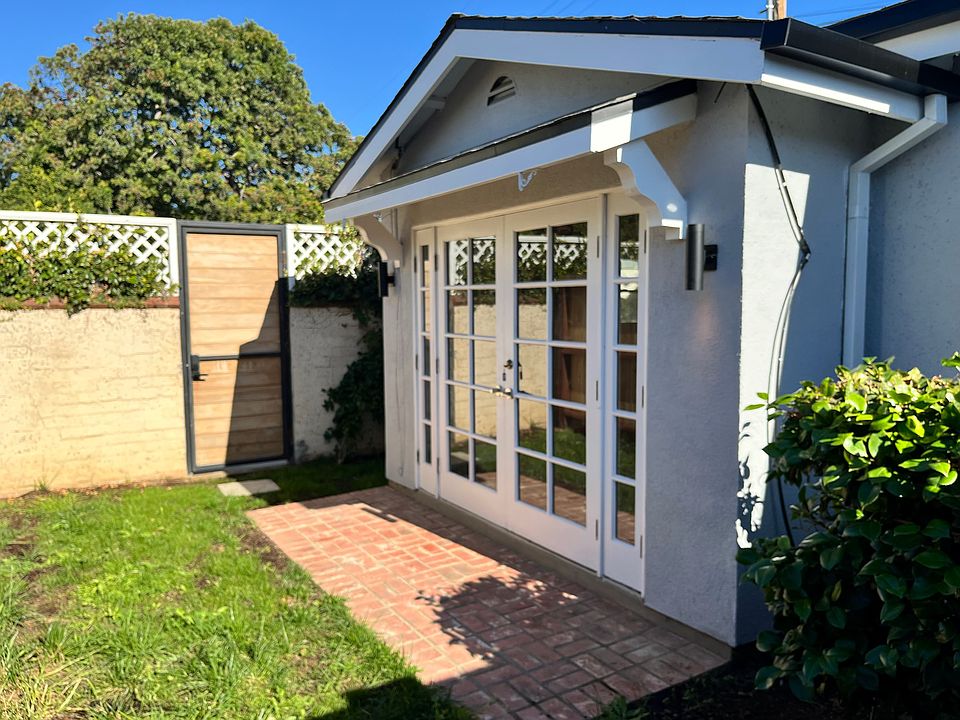 French door entry inside the gate.