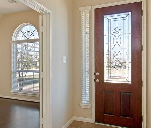 Enter onto beautiful tiled floors.