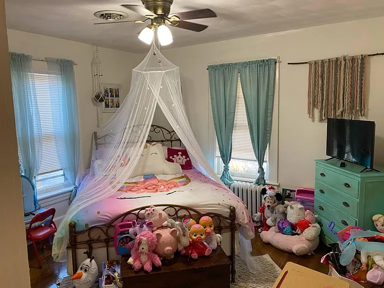 Bedroom Two w/ Designer Ceiling Fan and Two Large Windows. All Cordless Blinds Provided by Landlord.
