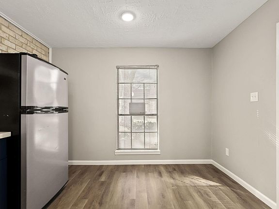 kitchen view of fridge, window, break nook