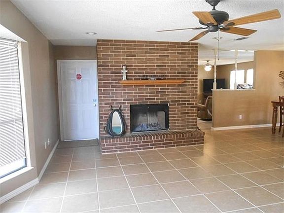 second living area or family room with fireplace to cozy up to in the wintertime after working outside with your horses