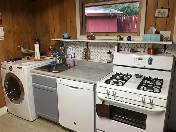 One angle of the kitchen convenient all-in-one laundry machine.