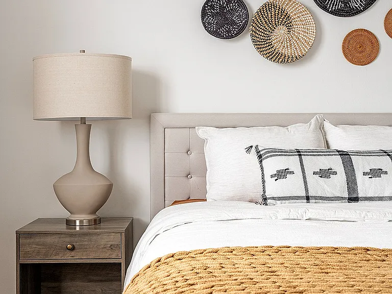 Experience warmth and elegance in this thoughtfully designed bedroom.