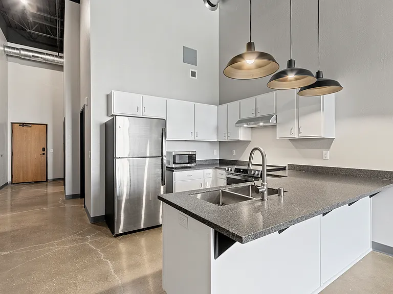 Where style meets function: sleek stainless steel appliances and durable countertops ready for everything from quick bites to shared dinners.