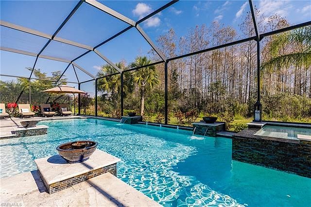 41x12 pool and spa, multicolored lights, fountains and torches