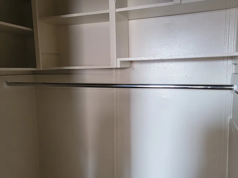 Very large closet with lots of shelving