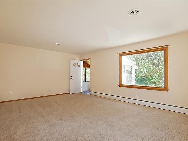 Living room; door to 3-season porch