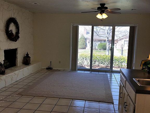 Living room with wet bar & sliding glass doors
