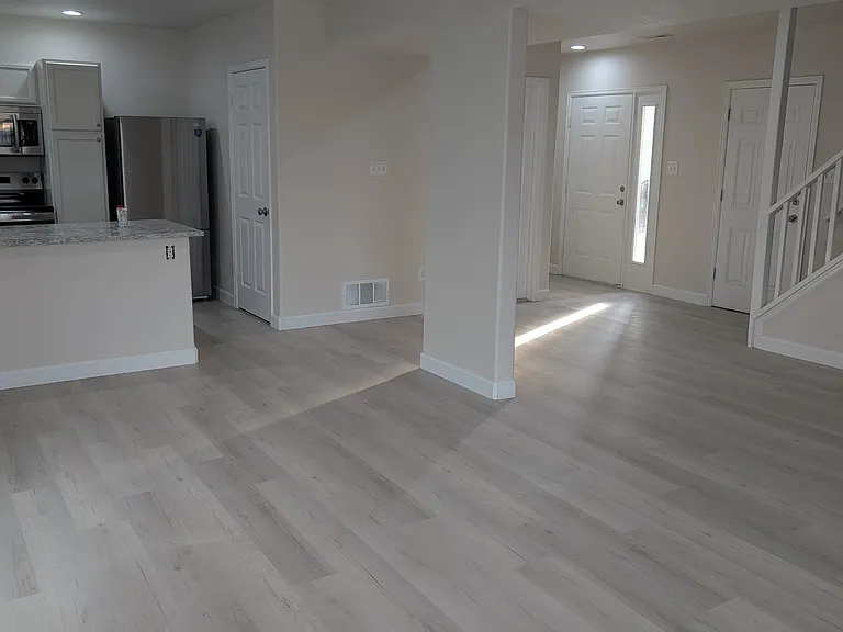 looking towards the front door and stairs leading to your top floor sanctuary